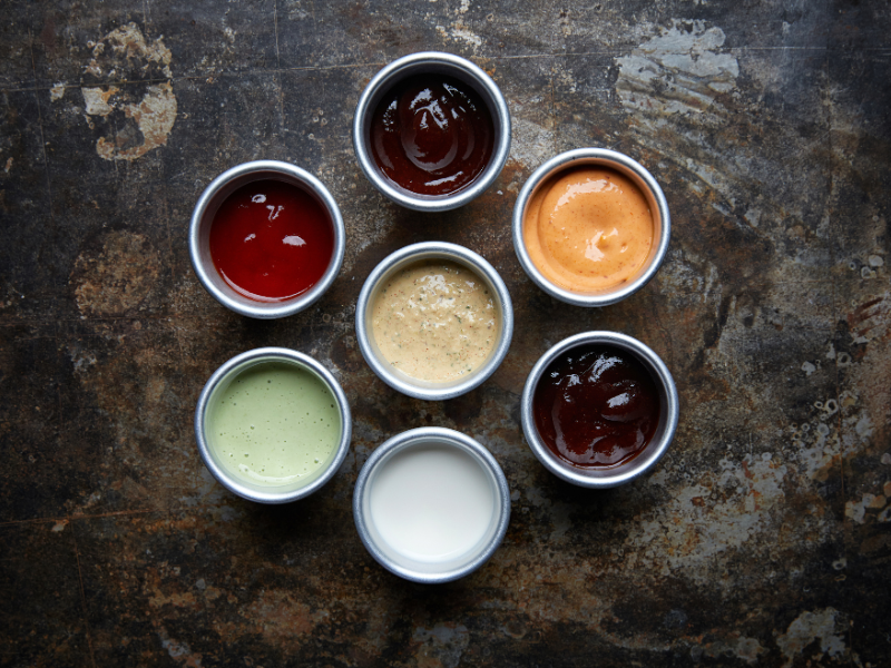 Various sauces symbolizing a strong call to action (CTA's) as the 'secret sauce' for increased customer engagement, from Sprout Marketing and Design’s blog